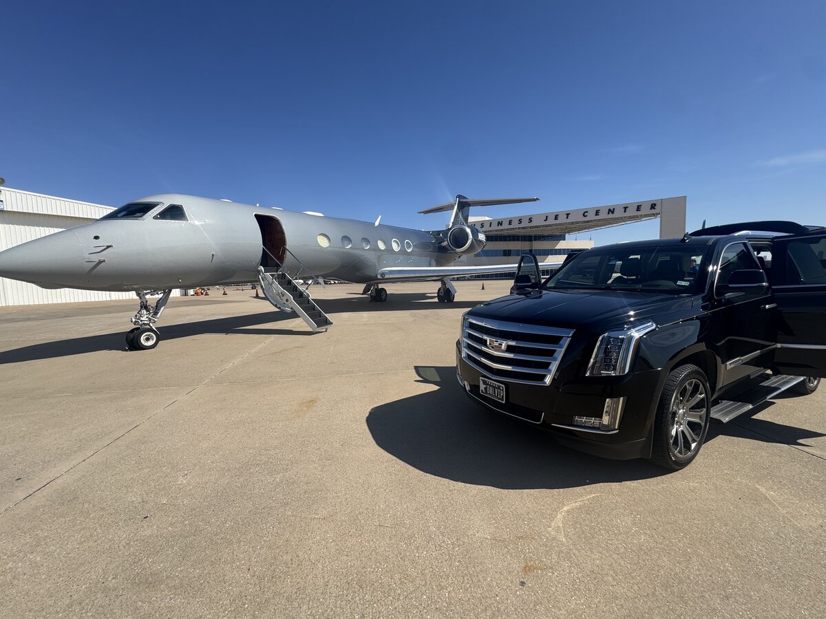 Luxury private jet and Cadillac on the tarmac