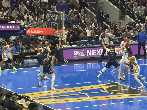 Dallas Mavericks - Mavs defenders contesting a shot under the basket at American Airlines Center - Dallas VIP
